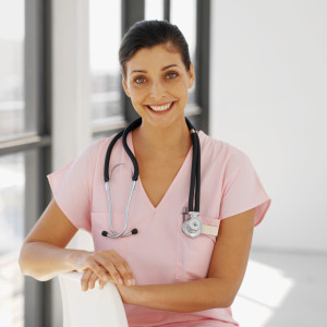 Close-up of a young nurse sitting on chair